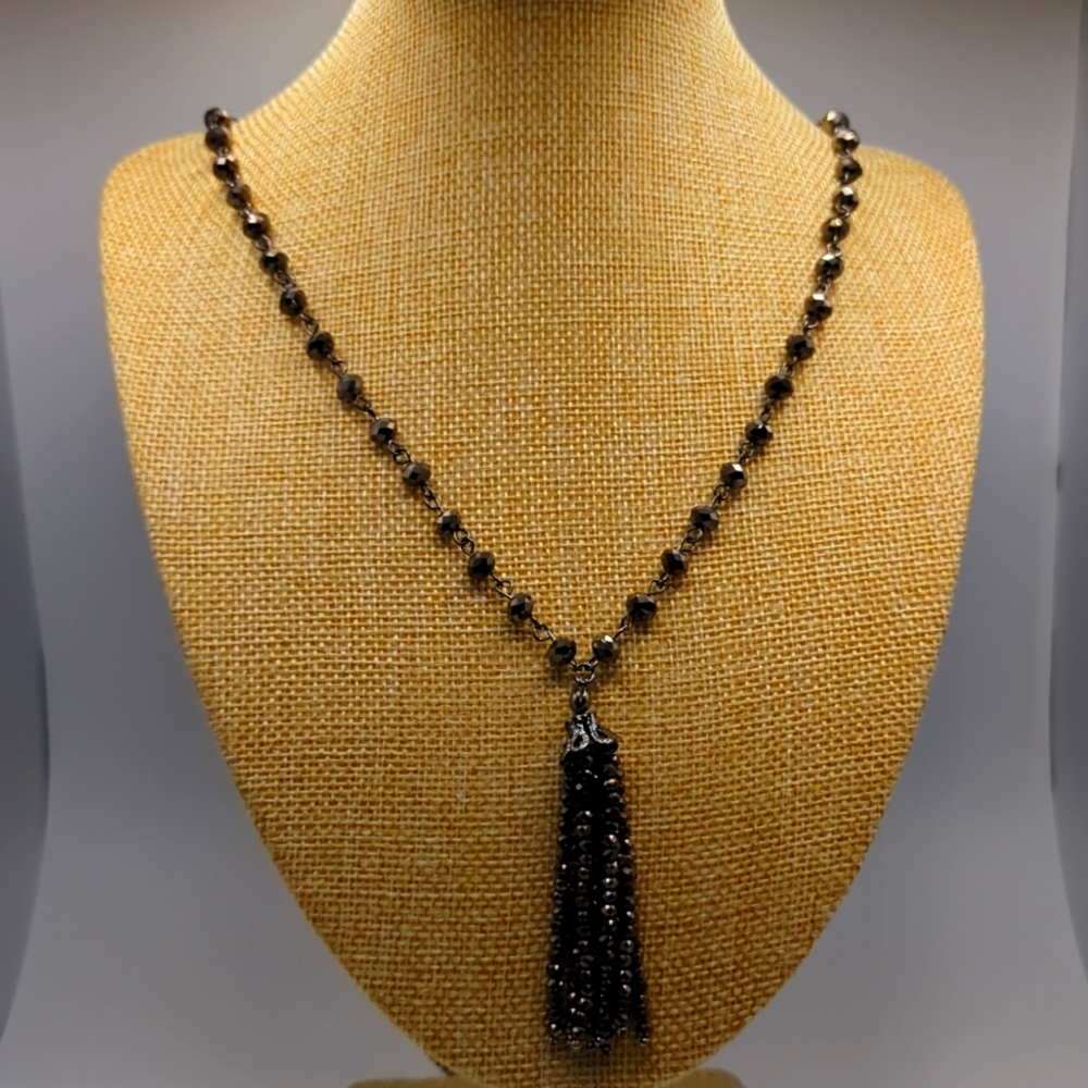 Antique Silver with antique bronze dangle on a nice long necklace